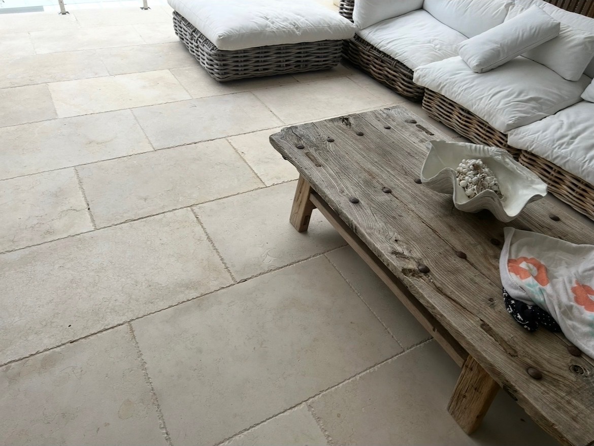Pale limestone patio pavers — staggered layout