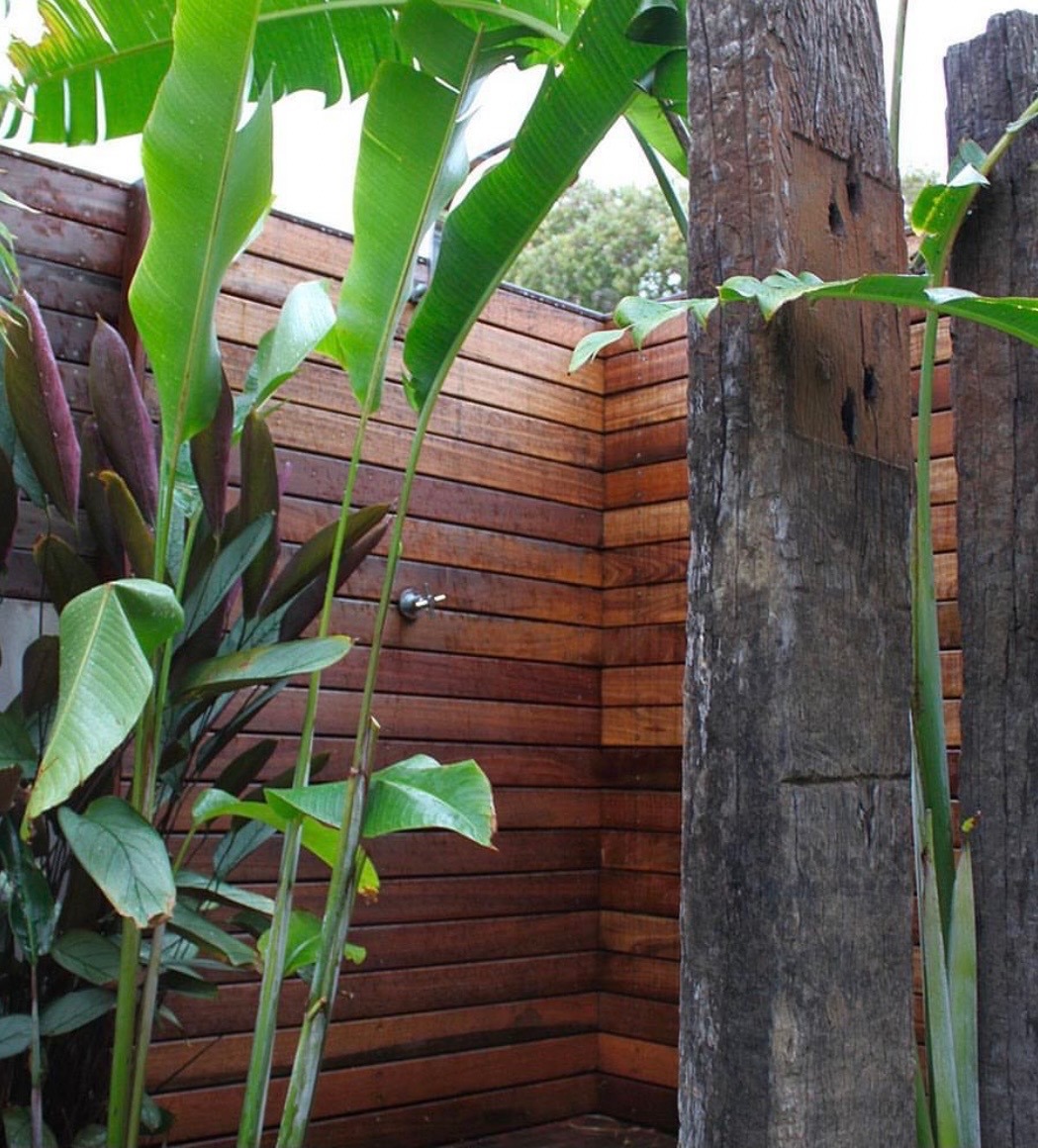 Timber privacy screen & outdoor shower in a landscaped garden nook