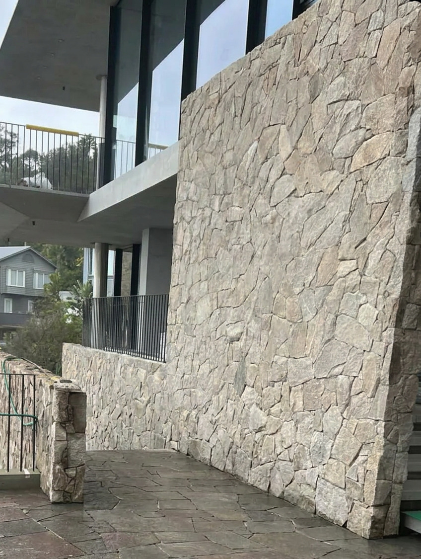 Crazy-pave stone terrace & natural stone feature wall