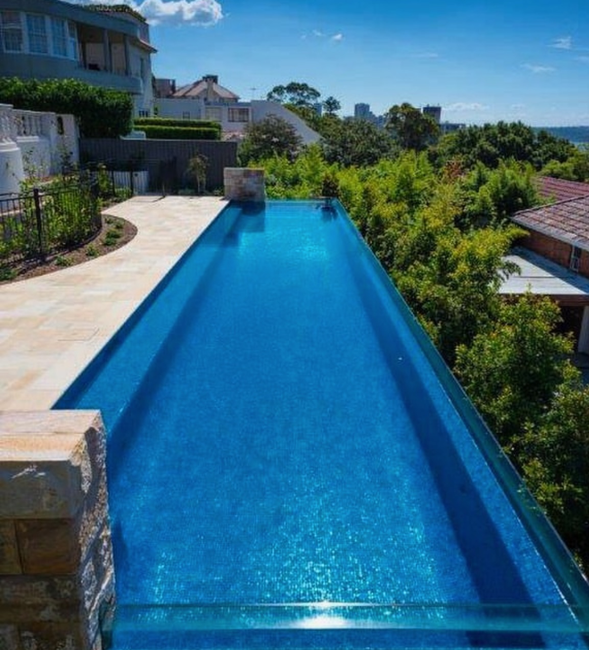 Sandstone pool paving & harbour-view lap pool
