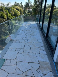 Crazy-pave balcony with glass balustrade